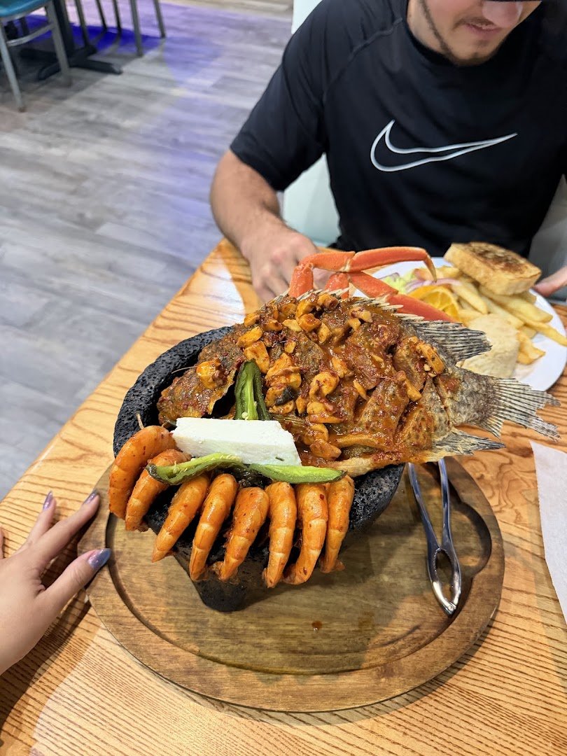 Seafood restaurant interior with casual seating.